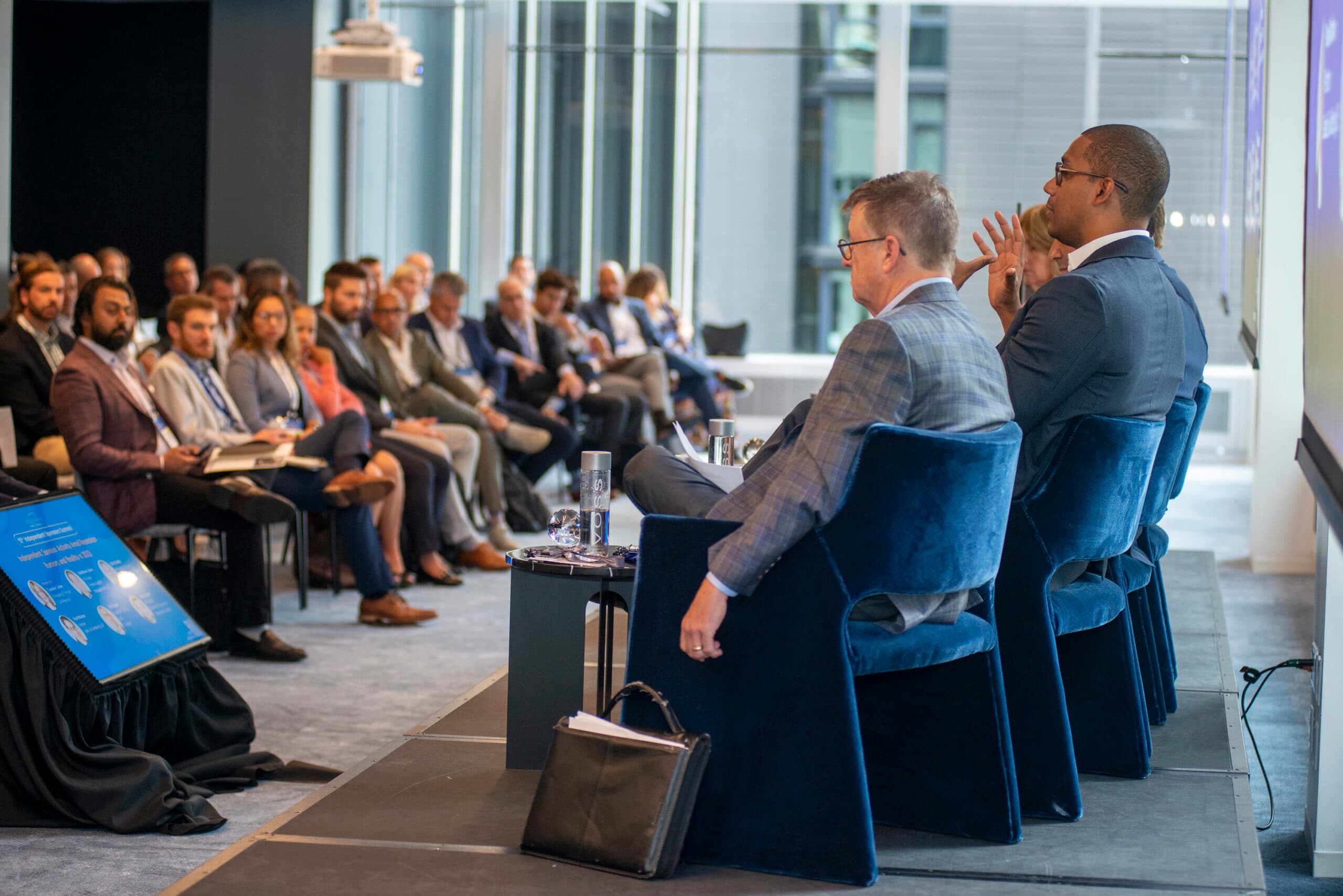 Speakers in conversation at an iGlobal Forum event